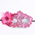 Close-up of pink lace mask with decorative floral mesh and sparkling rhinestones - Rose Red