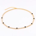 Gold tennis necklace with white pavé zircons and eight round black gemstone accents - 18K Gold Plated / Black Zirconia