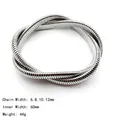 Detailed close-up of a silver stainless steel spiral snake chain bangle with 8mm width - Double Layer Wrapped Bracelet (8mm Width/55mm ID) / Steel