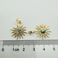 Macro detail of sun and moon pendants with shell inlays and scale for size reference - Sun Moon And Stars (white Shell)