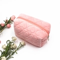 Macro view of pink heart-quilted velvet stationery bag with smooth zipper detail - Heart Quilted Standard / Pink