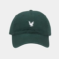 Close-up of dark green cotton baseball cap with white eagle embroidery and textured fabric - Adjustable / Green