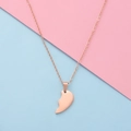 Detailed close-up of rose gold half heart pendant on a thin cross chain for couples - Small Rose Gold Single Piece