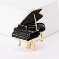 Elegant black enamel grand piano brooch with gold plating on a minimalist white background - Black