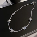 Elegant silver butterfly pendant necklace featuring sparkling cubic zirconia on a tennis chain - Style 34