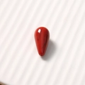 Macro detail of a red teardrop resin bead with agate texture for DIY jewelry making - 1 Piece / Wine Red Smudge