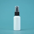 White plastic spray bottle with black nozzle and clear cap on cyan blue background - 30ml / Porcelain White Bottle Black Spray