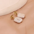 Elegant gold rose stud earrings with baroque rectangular pearl drops on silk background - Rose Gold-Tone White Baroque