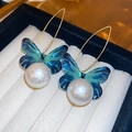 Boucles d'oreilles papillon bleues élégantes avec perles blanches et longs crochets - Style Perle Papillon Bleu Foncé