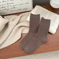 Dark brown ribbed mid-calf wool socks for women styled in a cozy autumnal scene - One Size / Coffee