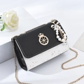 Women's black and white crossbody chain bag with star studs and pearl bow charm - With Pendant / Black