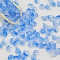 Macro shot of gradient blue lily of the valley glass beads on a white background with wood spoon - Lily of the Valley 12# Deep Blue 7x12mm
