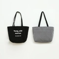 Close-up of canvas tote bag featuring Young wild and free print and striped patterns - 33*27.5cm / Black Stripe Reversible
