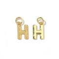 Detail of two 18K gold plated letter H charms with jump rings on a white background - Letter H