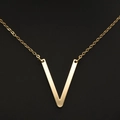Elegant gold-plated necklace with a polished V-shaped pendant on a fine cross chain - Gold V