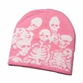 Detailed close-up of a pink knitted beanie with a white skeleton bone pattern - White Skull-Pink