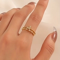 Golden heart crown ring with double bands and sparkling diamonds worn on finger - Gold Double Crown Heart Ring (0297)