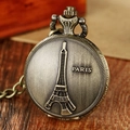 Close-up of vintage bronze pocket watch featuring Eiffel Tower relief and Paris engraving - P892/Paris Eiffel Tower