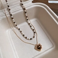 Close-up of double-layer necklace with tiger eye heart pendant and beaded chain - 22# Heart Tiger Eye Beaded Necklace Set (Gold Plated)