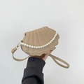 Minimalist beige shell shoulder bag with pearl chain decoration and adjustable strap - Camel