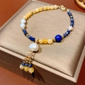 Handcrafted bracelet with yellow tiger eye, blue stones, and white pearl tassel charms - 16# Bracelet - Gold and Blue