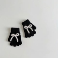 Primer plano de guantes de punto negros con lazos blancos y forro suave de felpa - Aprox. 2-6 Años / Negro