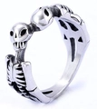 Macro detail of gothic stainless steel skeleton ring with double skull and rib design - 24401