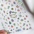Detail of 3D embossed nail stickers featuring green plant patterns and leaf motifs - TS-761 Green Jungle
