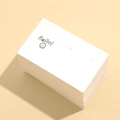 Stack of white smiley face earring display cards with pre-drilled holes for jewelry packaging - 1 Sheet / 7.5*4.5cm (2 Holes)