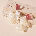Detail of resin heart stud earrings with white pearl petals on travertine stone - Pink Heart White Petal Drop Earrings (S925 Silver Pin)