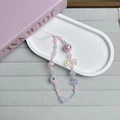 Dettaglio del laccetto per telefono con tulipani rosa e blu e perline in acrilico - Perline Dipinte Blu Rosa
