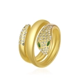 Detailed view of gold triple-layered snake ring with pavé crystals and green eyes - Casting Snake