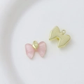 Detail view of pink frosted heart pendant with golden bow and metal ring for DIY jewelry - Style 24