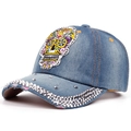 Detail of blue denim baseball cap with sugar skull embroidery and silver studs - Adjustable / Blue