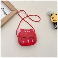 Detail of red cartoon cat toddler bag with woven shoulder strap and cute cat face pattern - Red