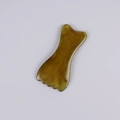 Brown resin massage scraping tool with wavy teeth for facial Gua Sha therapy - Small Buddha Hand (Amber)