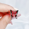 Macro shot of silver ring with detailed red and black enamel butterfly design - Glossy Red Butterfly Open Ring (JZ3740)