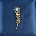 Vintage golden feather brooch with turquoise stone on elegant blue silk background - Feather Style (XD9112)