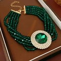 Detailed view of emerald green multi-strand beaded bracelet with gold rhinestone charm - Necklace-Green