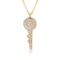 Macro shot of 18k gold heart key pendant featuring sparkling zircon micro-pave details - Flower Cluster Round Full Stone Key Style (c183)