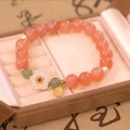 Elegant bracelet with orange beads, white flower charm, and small golden pendant in a box - S197-pink Peach Blossom Lotus Seed Bracelet #sz366