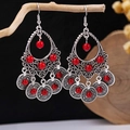 Macro shot of vintage silver earrings with red beads hanging on a rustic wooden branch - Antique Silver + Red Beads (E5775-8)