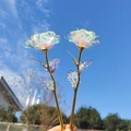 Artificial gold foil rose with colorful iridescent petals and golden stem in hand - Iridescent Gold