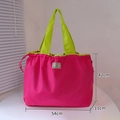 Pink eco-friendly folding tote with green handles and NAFY GALLERY woven label detail - XL Rose Red