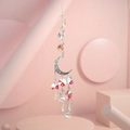 Detailed view of silver moon suncatcher with colorful crystal beads on pink background - US 4