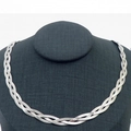 Silver braided herringbone chain necklace displayed on a professional black neck mannequin - 3-Strand 40cm Steel Color Necklace