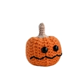 Handmade orange crochet pumpkin doll with black eyes on white background - A Pumpkin Head Only