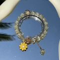 Handmade beaded bracelet with yellow daisy floral pendant on a mirror background - S060 - Yellow Daisy Bracelet #sz539
