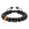 Macro shot of 10mm lava rock and tiger eye beads with golden letter J on woven bracelet - Letter-J