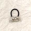 Silver wavy hollow metal hair tie with black elastic band on white background - Silver Irregular Wave 5cm